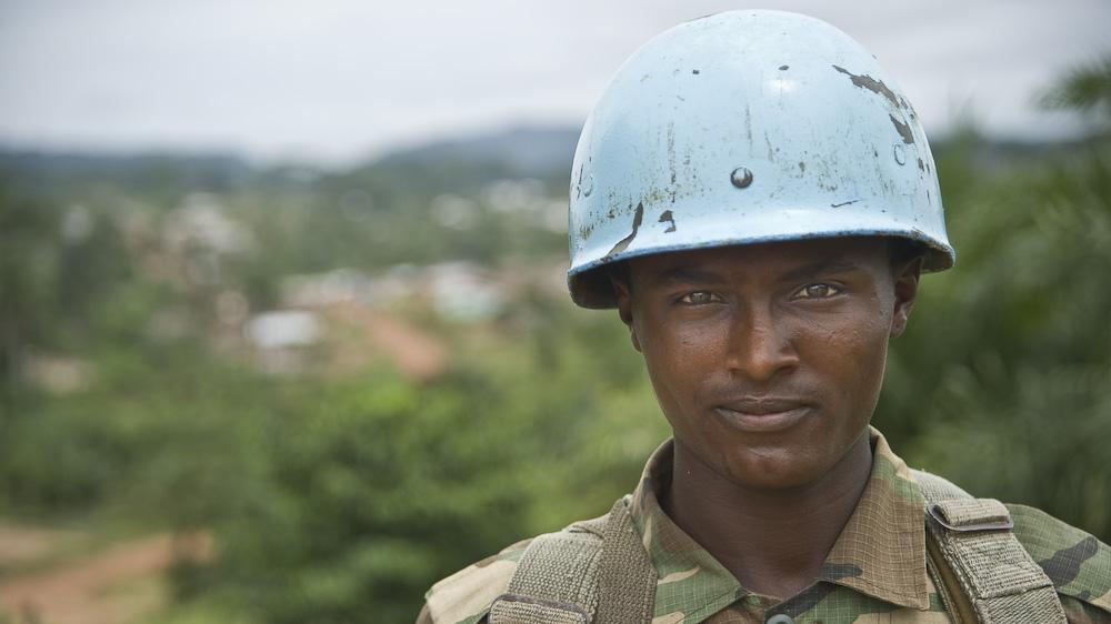 A peacekeeper wearing a blue helmet.