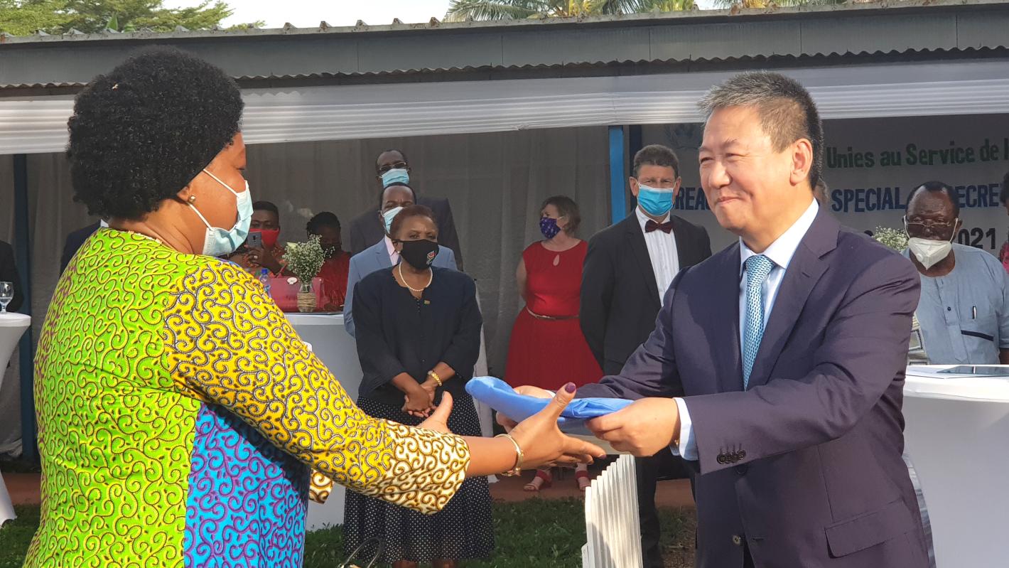 Special Envoy Huang Xia hands lowered flag.
