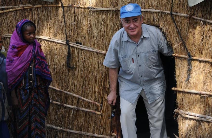 SRSG leaving a traditional thatched house